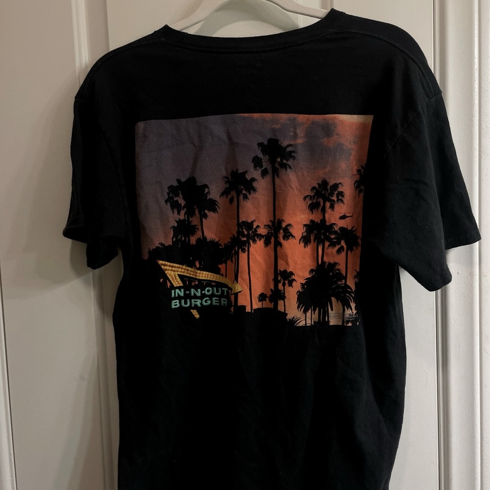 two graphic tees, vans, and in and out, both fit Like size M